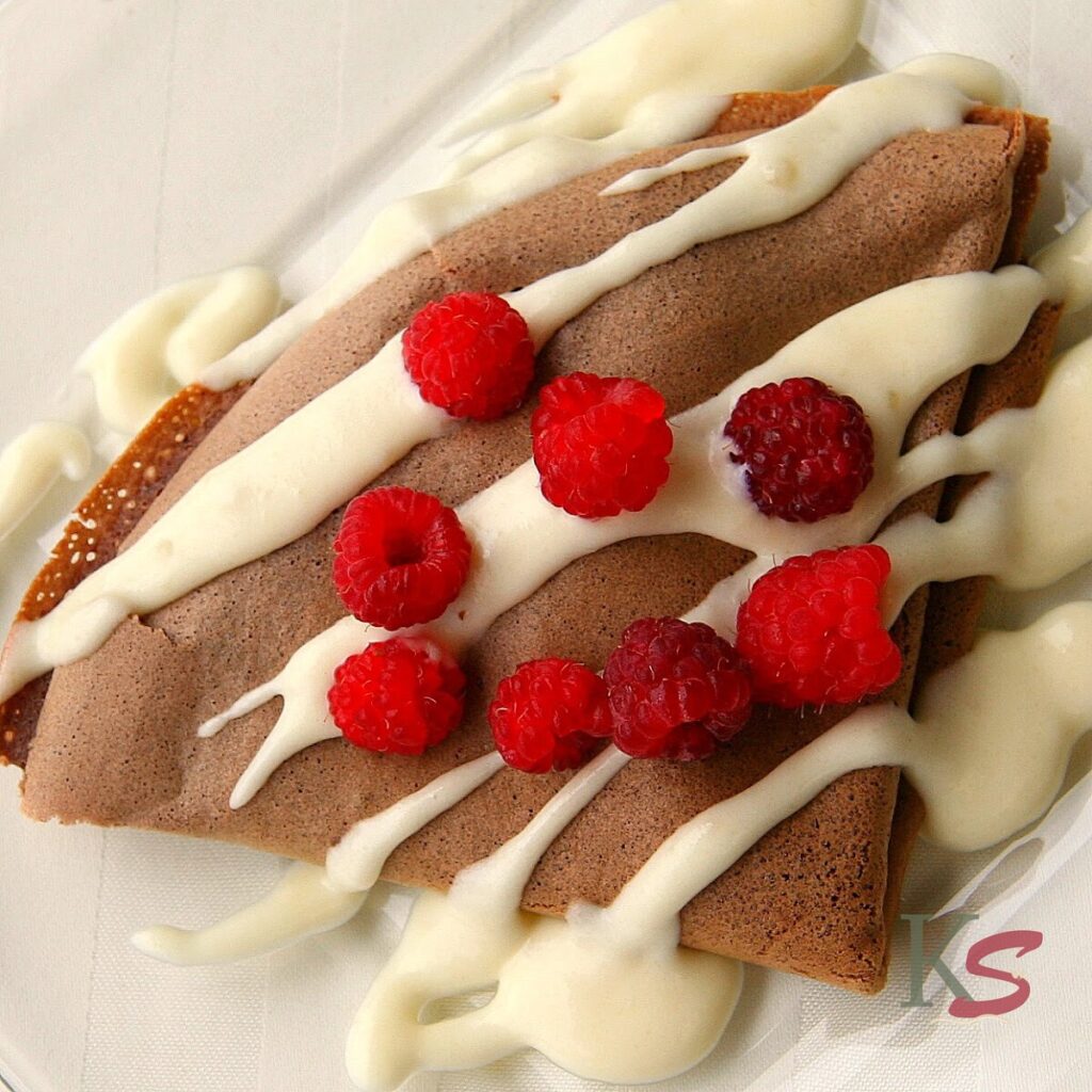Chocolate Crepes with Raspberries and Almond Cream Sauce