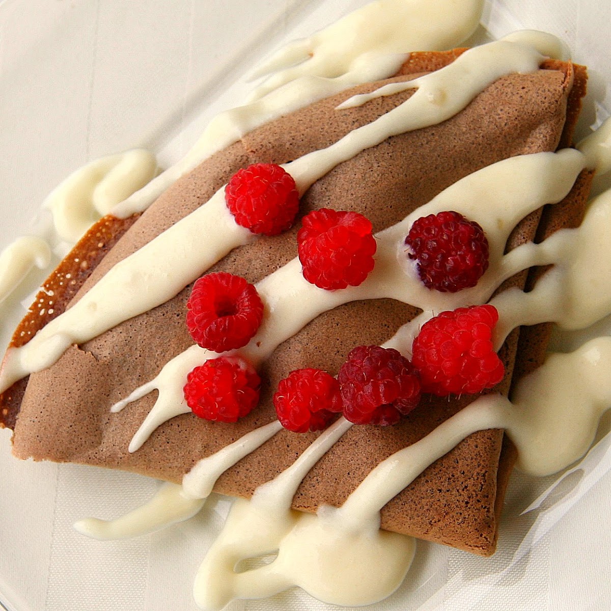 Chocolate Crepes with Raspberries and Almond Cream Sauce